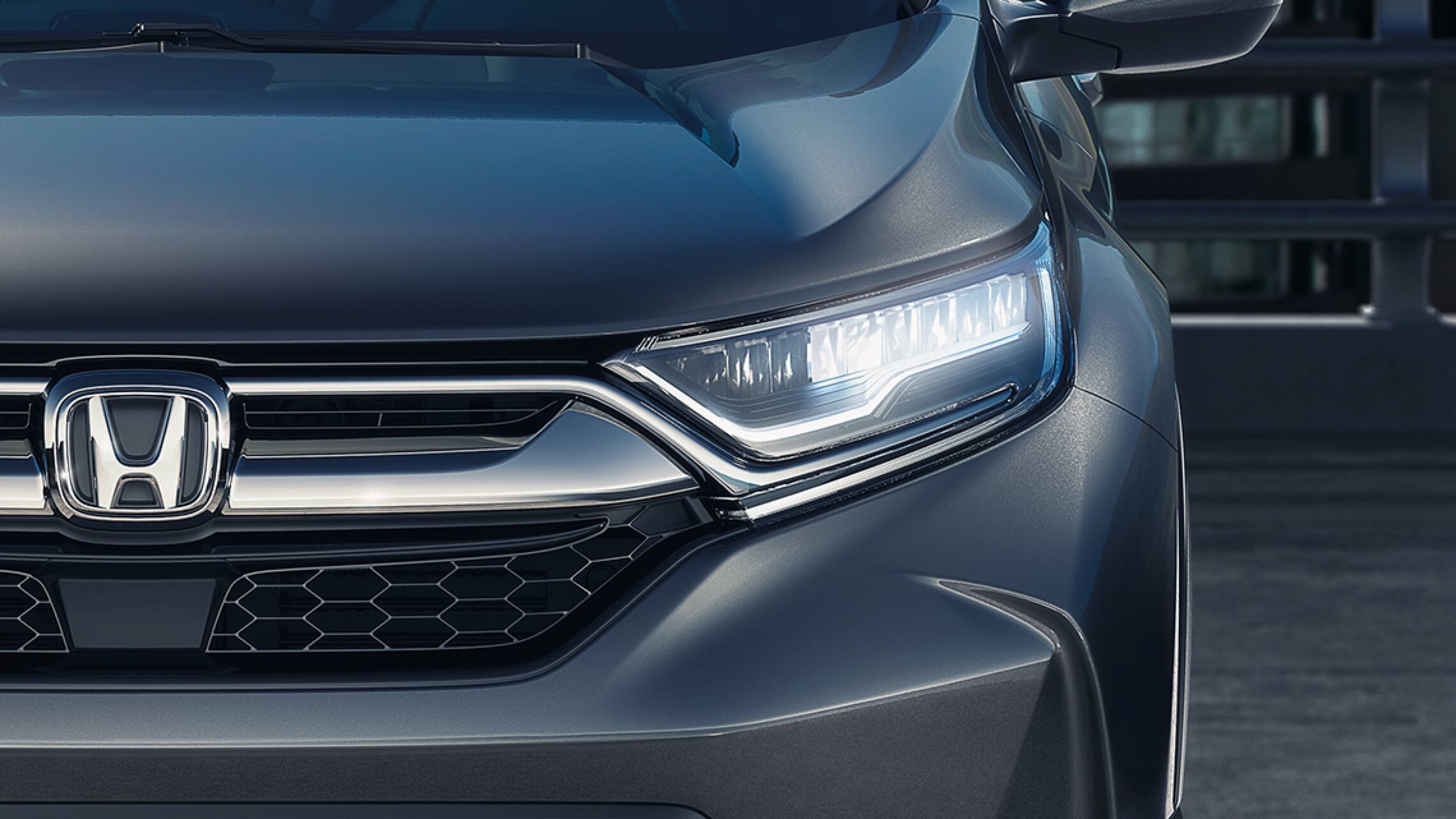 Front close up view of 2019 Honda CR-V Touring with full LED headlights with auto-on/off.