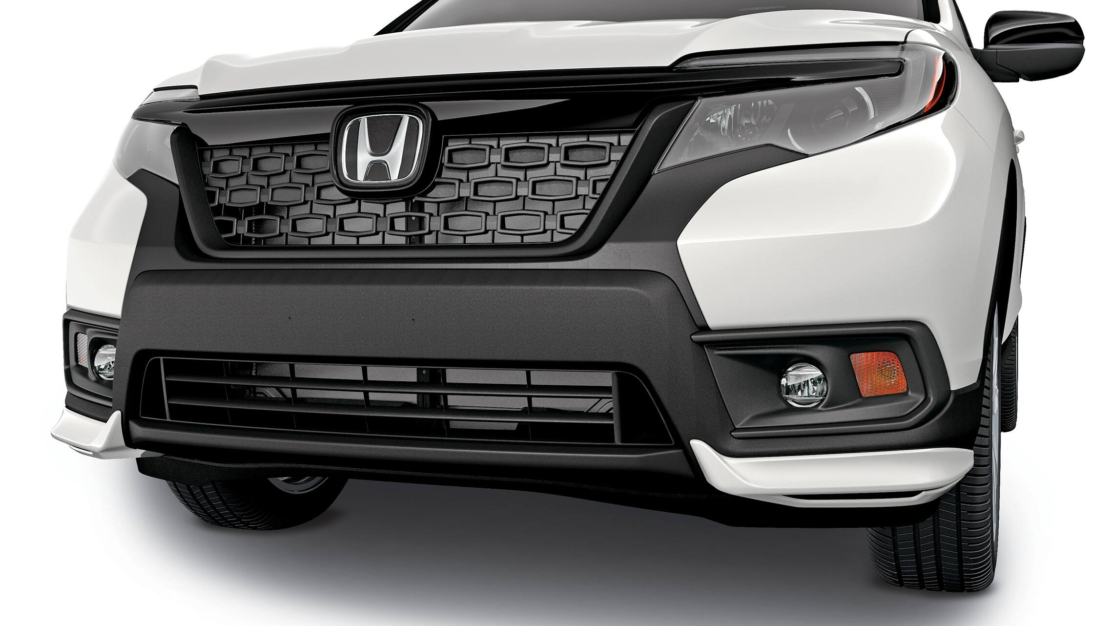 Detail of accessory front underbody spoiler on the 2019 Honda Passport.