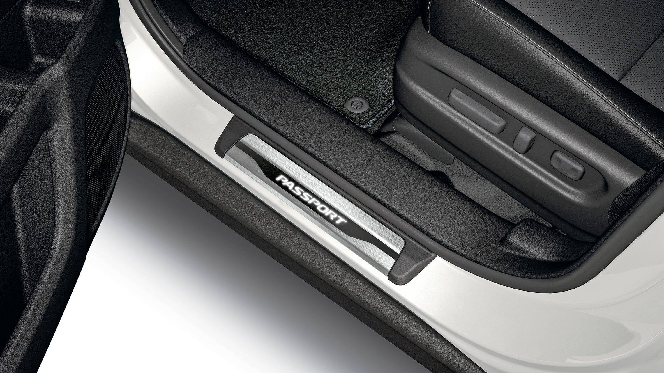 Detail of accessory illuminated door sill trim on the 2019 Honda Passport.